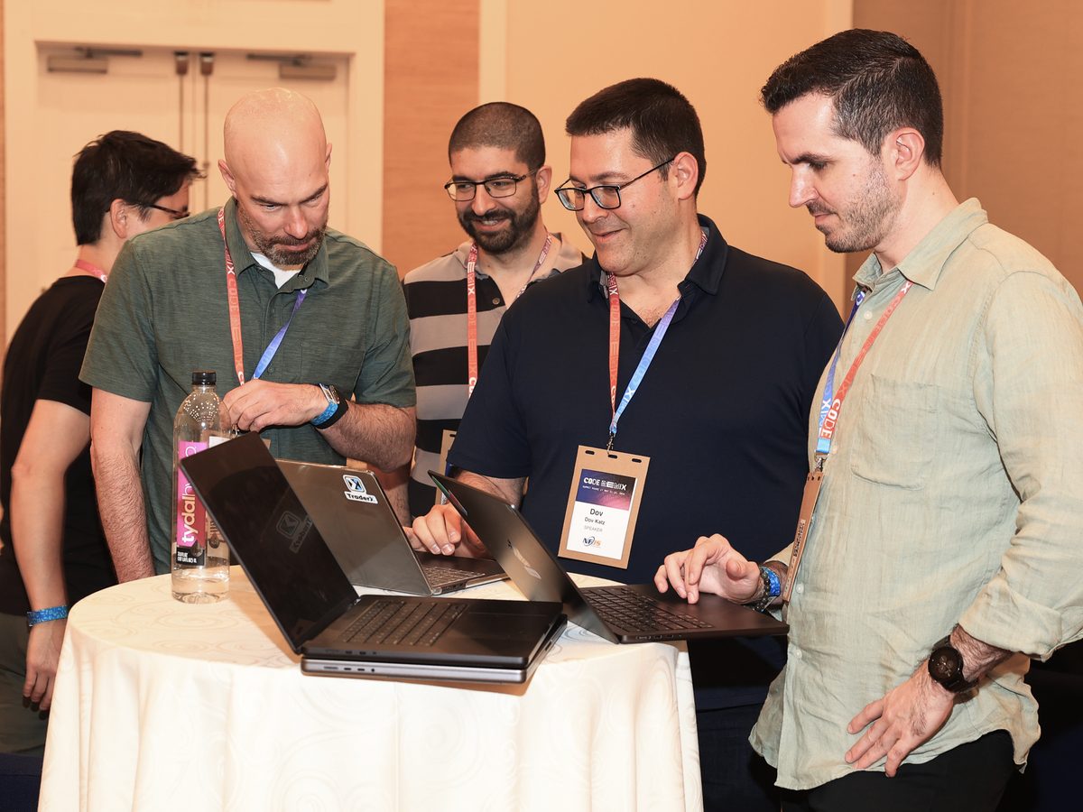 An impromptu demo at a Hack Track standing table